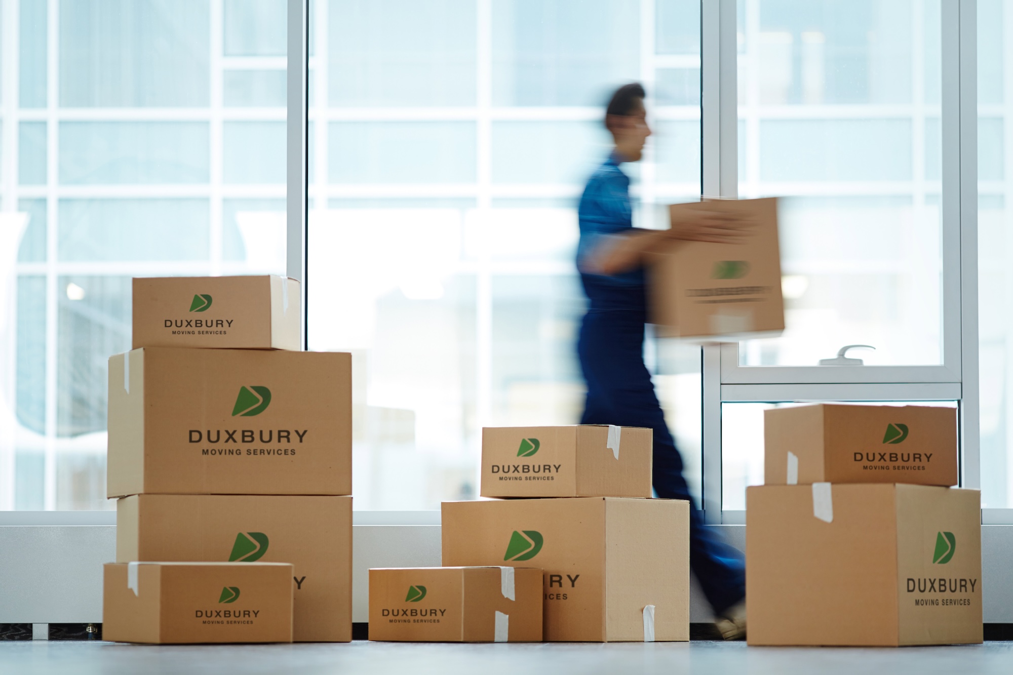 Man walking with moving boxes for a local or long distance move