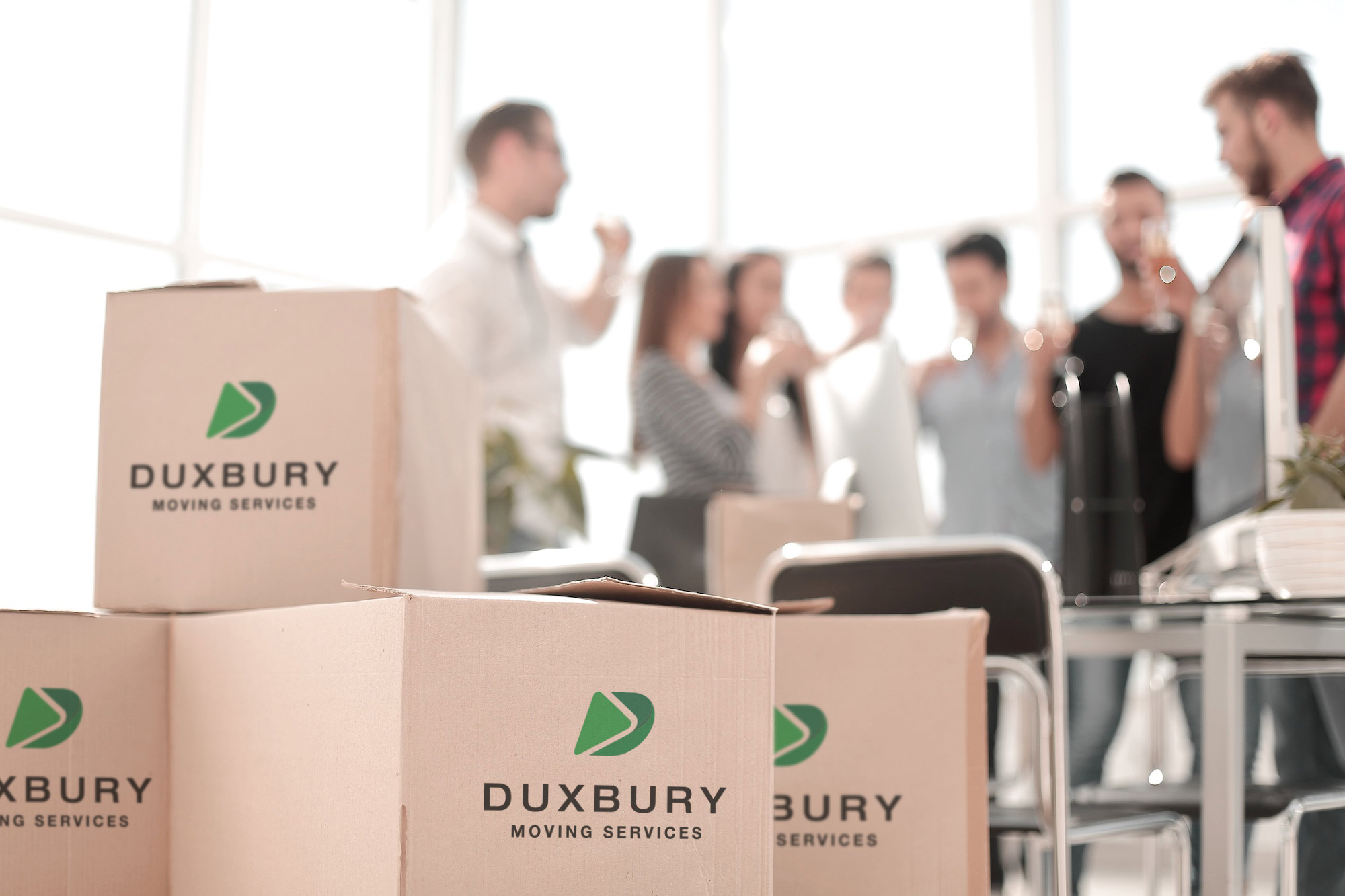 Office commercial moving boxes with staff in background