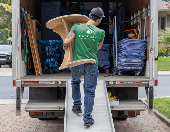 Duxbury Mover moving furniture into moving truck